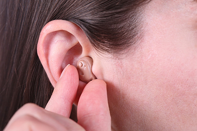 Hearing aids that fit in the ear.