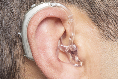 Hearing aids that fit behind the ear.